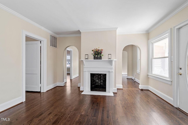 unfurnished living room with ornamental molding and dark wood-type flooring