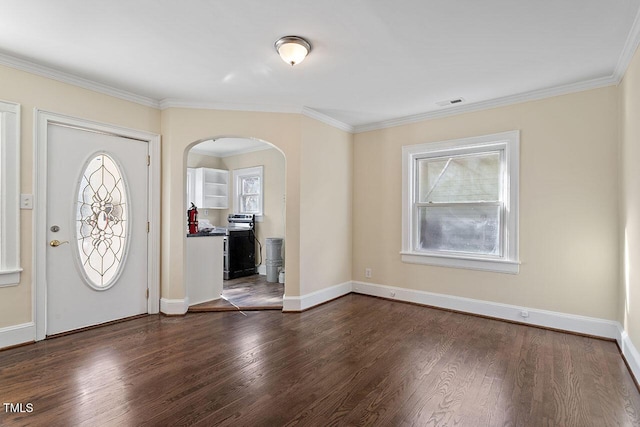 entrance foyer with dark wood-type flooring, crown molding, and plenty of natural light