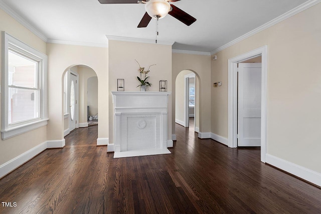 interior space featuring ornamental molding, ceiling fan, and dark hardwood / wood-style floors