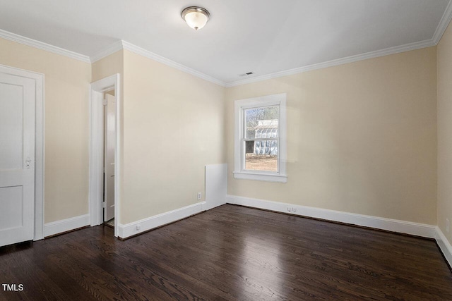 empty room featuring ornamental molding and dark wood-type flooring