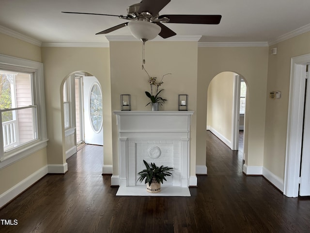 foyer entrance featuring ceiling fan, crown molding, and dark wood-type flooring