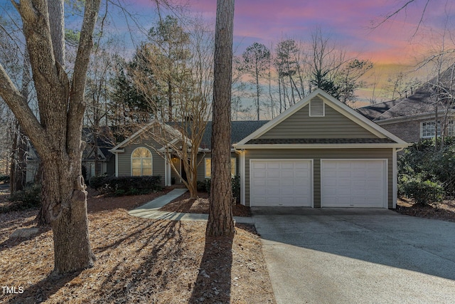 single story home featuring a garage