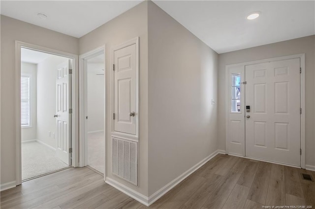 entryway with light hardwood / wood-style flooring