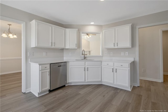 kitchen featuring white cabinets, ceiling fan with notable chandelier, stainless steel dishwasher, and sink