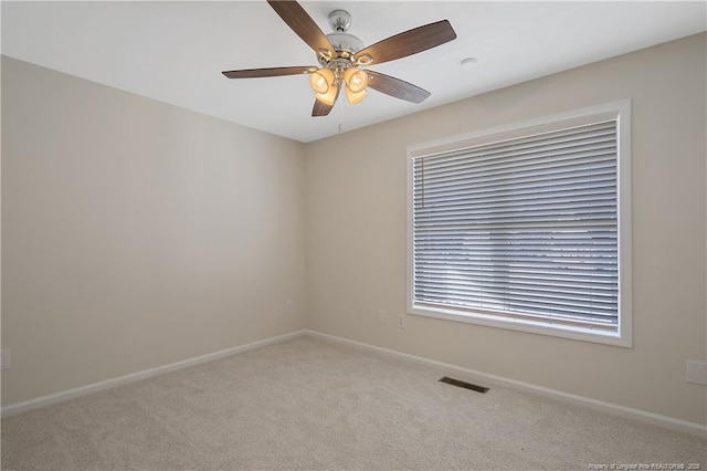 carpeted empty room with ceiling fan