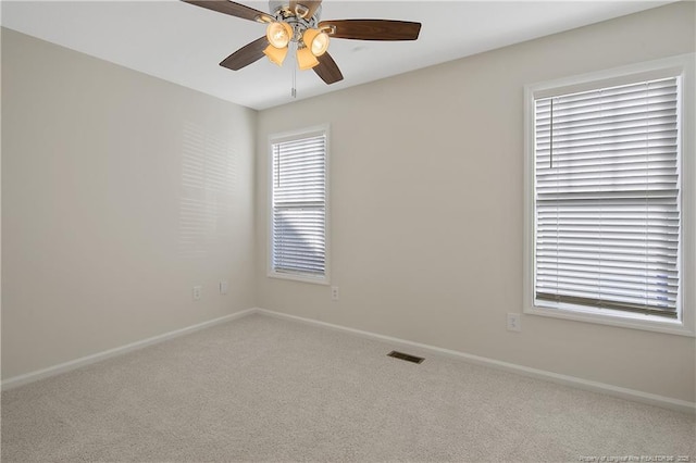 carpeted empty room with ceiling fan