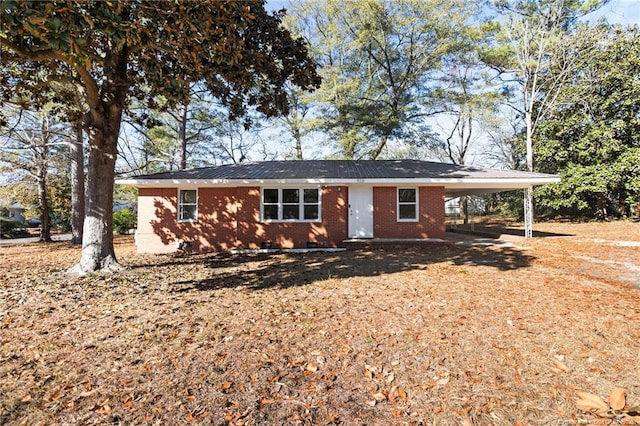 ranch-style house with a carport