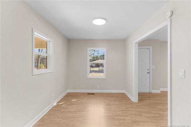 spare room with light hardwood / wood-style floors