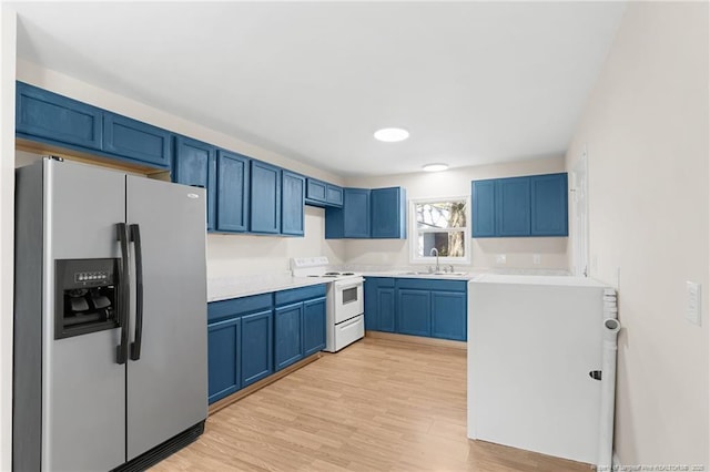 kitchen with stainless steel refrigerator with ice dispenser, blue cabinets, sink, light hardwood / wood-style floors, and white range with electric cooktop