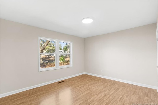 empty room with light wood-type flooring