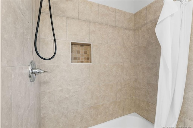 bathroom with shower / bath combination with curtain