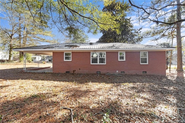 view of side of property featuring a carport