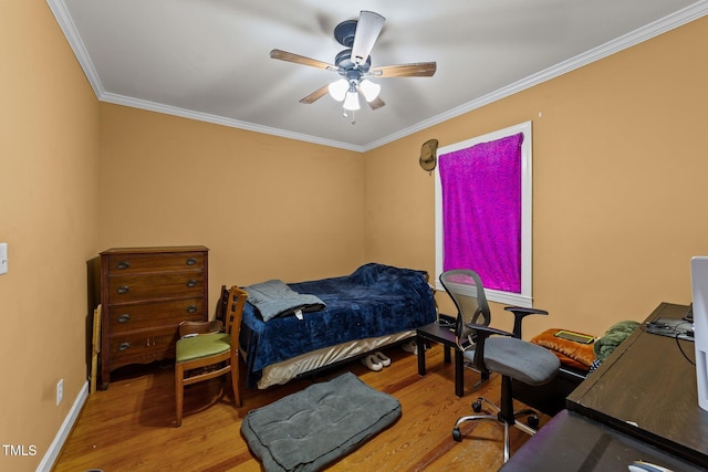 bedroom with ornamental molding, wood finished floors, a ceiling fan, and baseboards