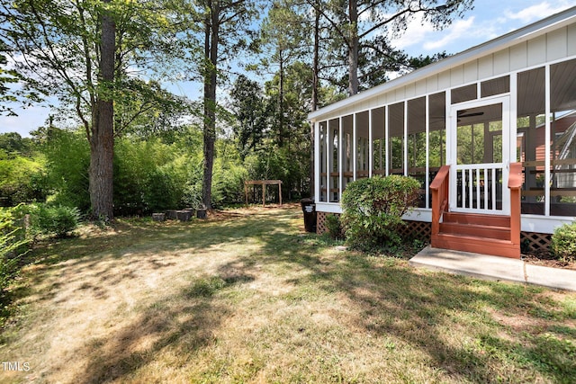 view of yard featuring a sunroom