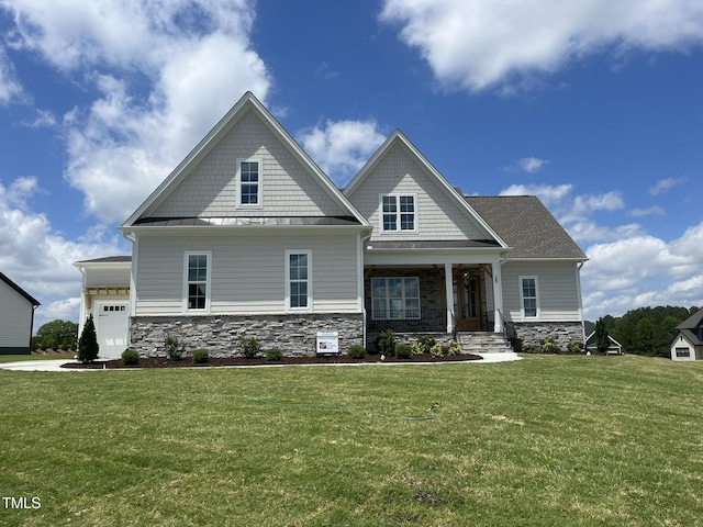 25 Deer Tail Ln Lot 52, Fuquay Varina, NC 27526 - craftsman-style home featuring stone siding, a standing seam roof, a front lawn, and a porch