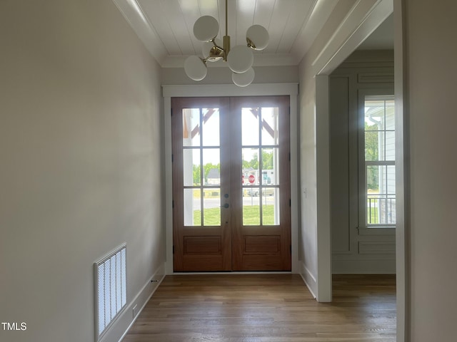 25 Deer Tail Ln Lot 52, Fuquay Varina, NC 27526 - doorway to outside with french doors, a chandelier, wood finished floors, ornamental molding, and baseboards