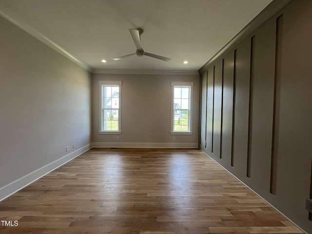 25 Deer Tail Ln Lot 52, Fuquay Varina, NC 27526 - unfurnished room with ornamental molding, healthy amount of natural light, ceiling fan, baseboards, and light wood-style flooring