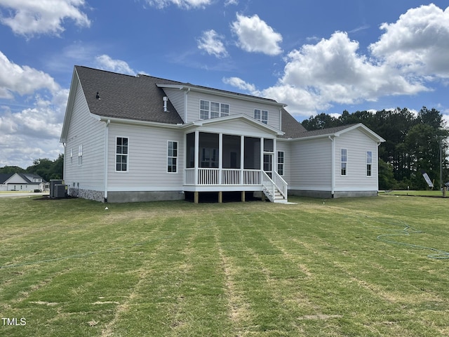 25 Deer Tail Ln Lot 52, Fuquay Varina, NC 27526 - rear view of house with a sunroom, central AC unit, a yard, and roof with shingles