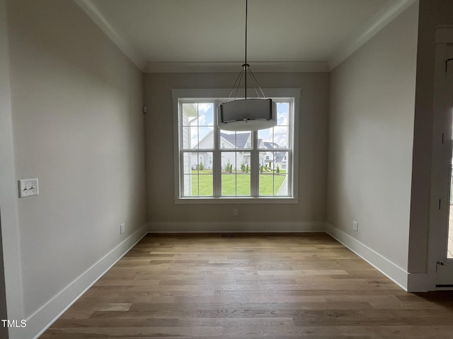 25 Deer Tail Ln Lot 52, Fuquay Varina, NC 27526 - unfurnished dining area featuring ornamental molding, baseboards, and wood finished floors