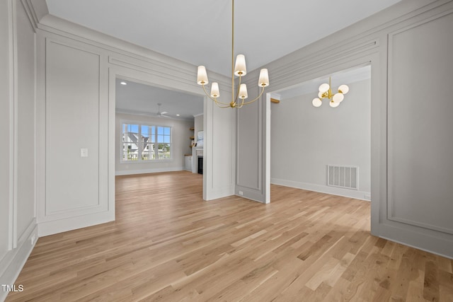 25 Deer Tail Ln Lot 52, Fuquay Varina, NC 27526 - unfurnished dining area with a chandelier and light wood finished floors