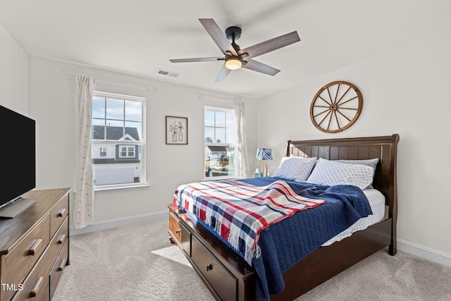 bedroom featuring ceiling fan and light colored carpet