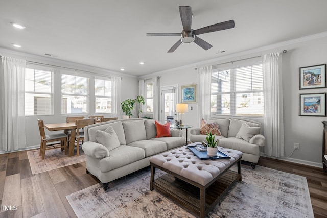 living room with crown molding, hardwood / wood-style floors, and ceiling fan