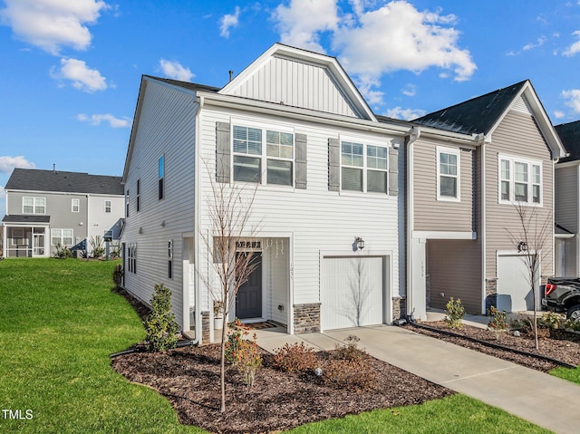 view of front of home featuring a garage and a front lawn