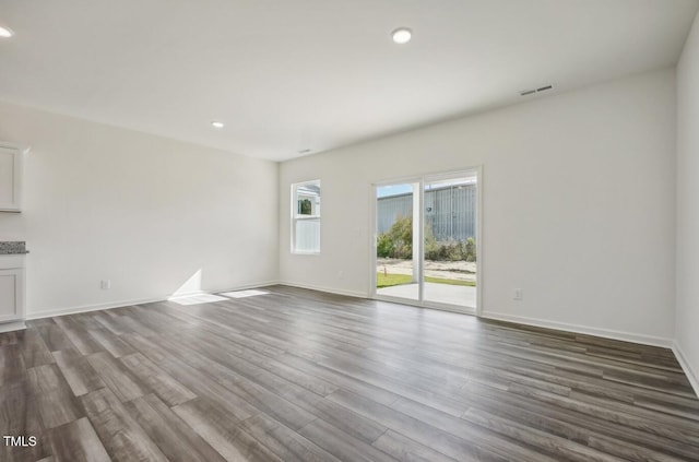 unfurnished living room featuring hardwood / wood-style flooring