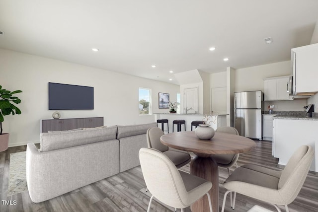 dining area with light hardwood / wood-style flooring