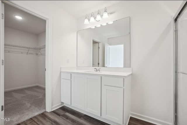 bathroom with hardwood / wood-style flooring and vanity