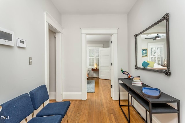 corridor featuring wood-type flooring