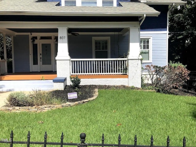 exterior space with a lawn and a porch