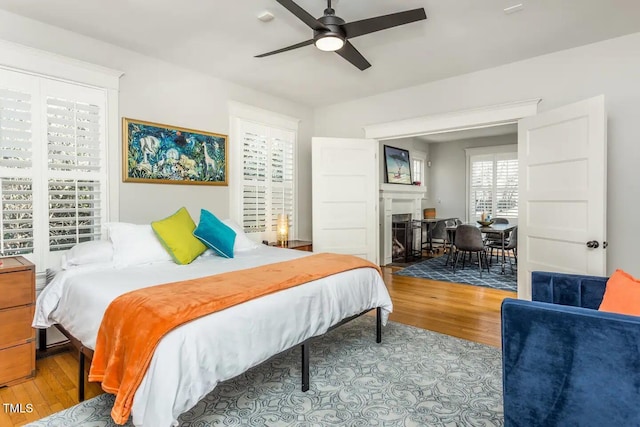 bedroom featuring light hardwood / wood-style floors and ceiling fan