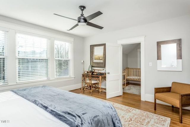 bedroom with hardwood / wood-style floors and ceiling fan