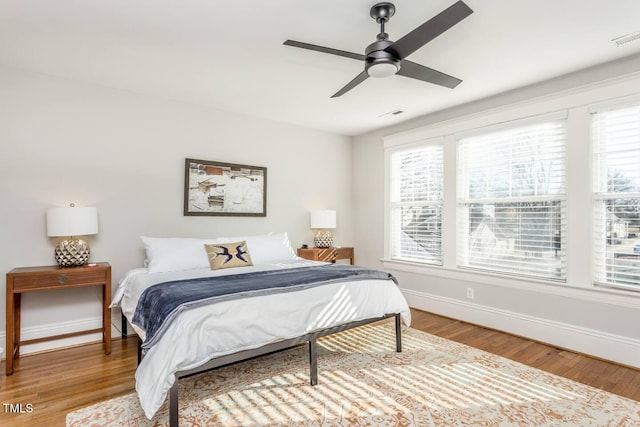 bedroom featuring wood-type flooring and ceiling fan