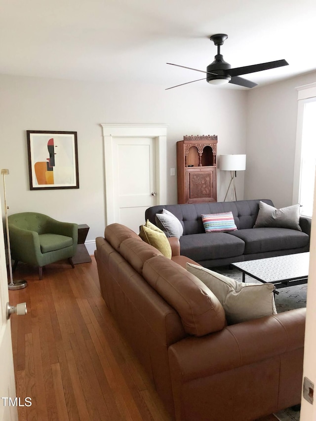 living room with hardwood / wood-style flooring and ceiling fan