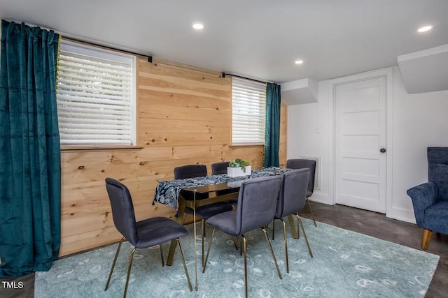 dining space with wooden walls