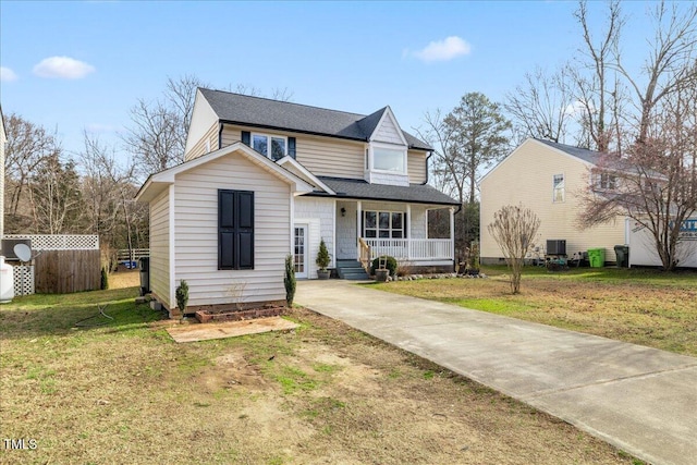 front facade featuring a front lawn and a porch