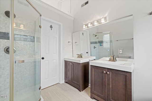 bathroom with vanity, toilet, and an enclosed shower