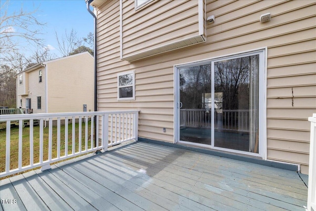 deck featuring a lawn