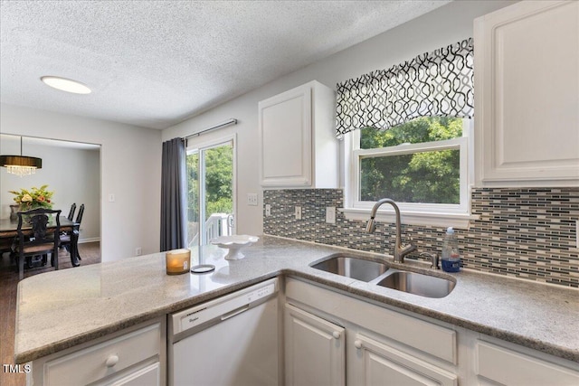 4708 River Boat Landing Ct, Raleigh, NC 27604 - kitchen with dishwasher, a sink, a textured ceiling, backsplash, and white cabinetry