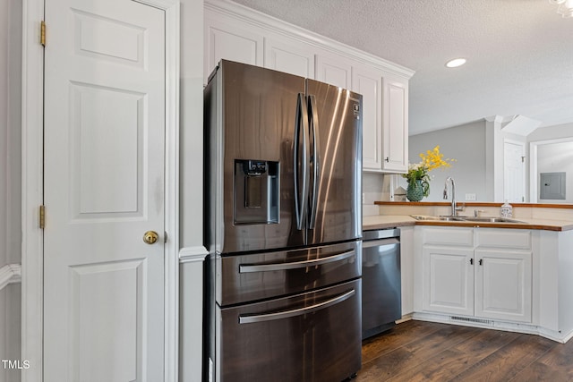 kitchen featuring white cabinetry, sink, dark hardwood / wood-style floors, and appliances with stainless steel finishes