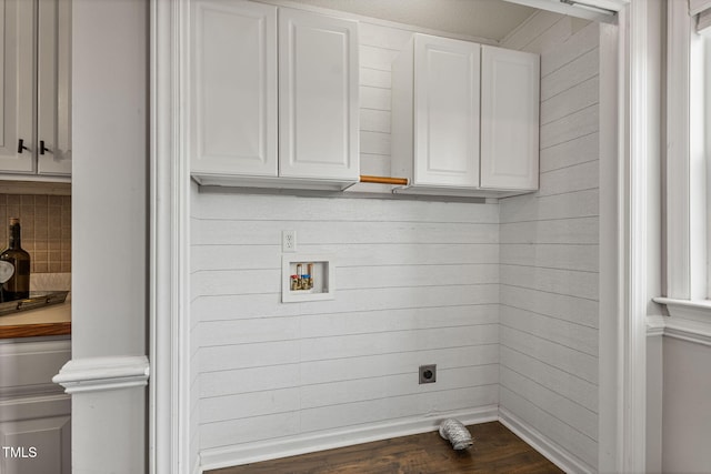 laundry area featuring hookup for an electric dryer, washer hookup, and dark wood-type flooring