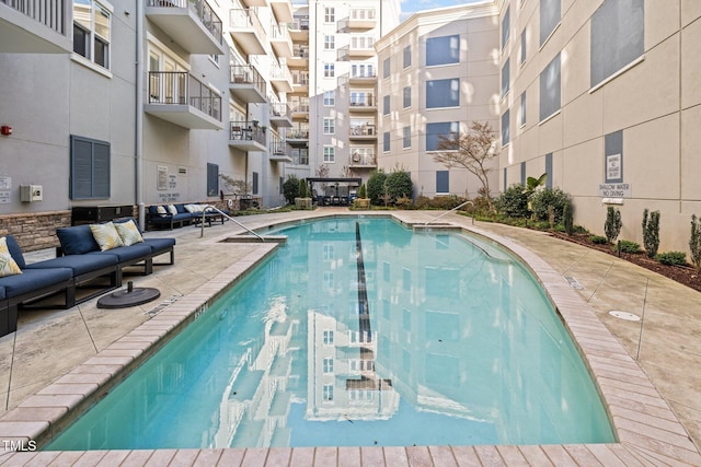 view of swimming pool with a patio