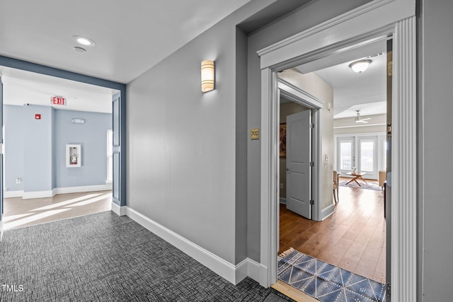 hall featuring french doors and hardwood / wood-style flooring