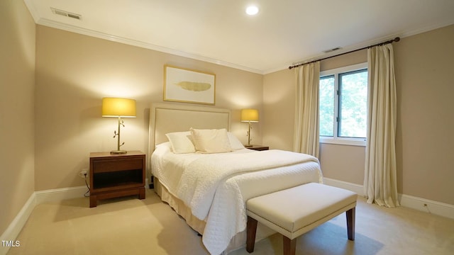 bedroom with crown molding and light carpet