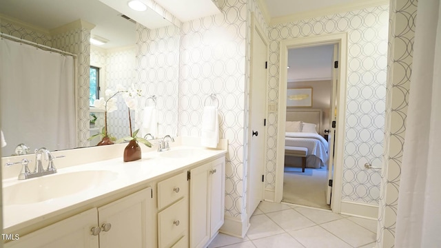 bathroom with vanity, tile patterned floors, and crown molding