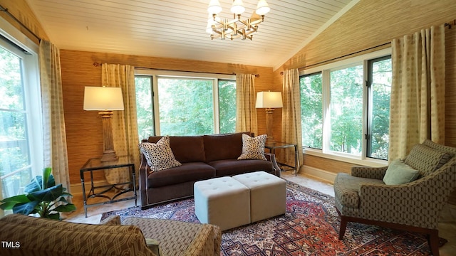 sunroom / solarium featuring a chandelier, wood ceiling, and vaulted ceiling