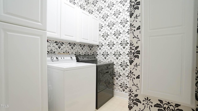 washroom with cabinets and independent washer and dryer