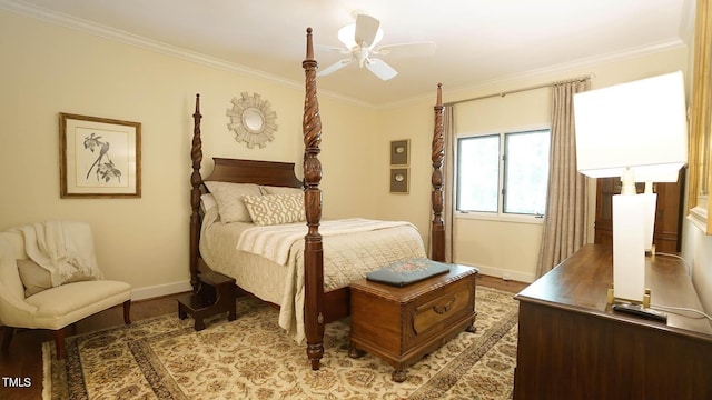 bedroom with ceiling fan, wood-type flooring, and crown molding